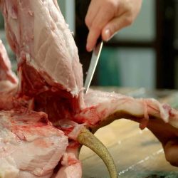 butcher-cuts-pork-meat-in-a-slaughterhouse- (1)